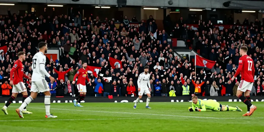 Exciting action during the Manchester United vs Liverpool match with passionate fans and players in action.
